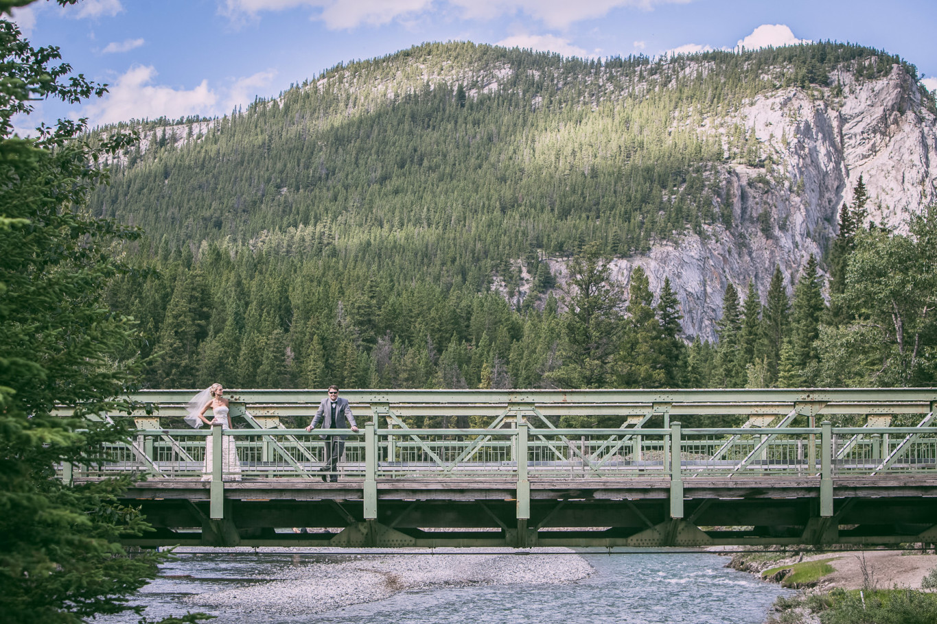 banff fairmont canada wedding by steve lee photography bride and groom portrait on bridge