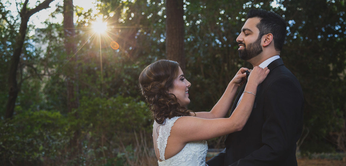 abdullah wedding fixing tie at houstonian hotel by steve lee photography