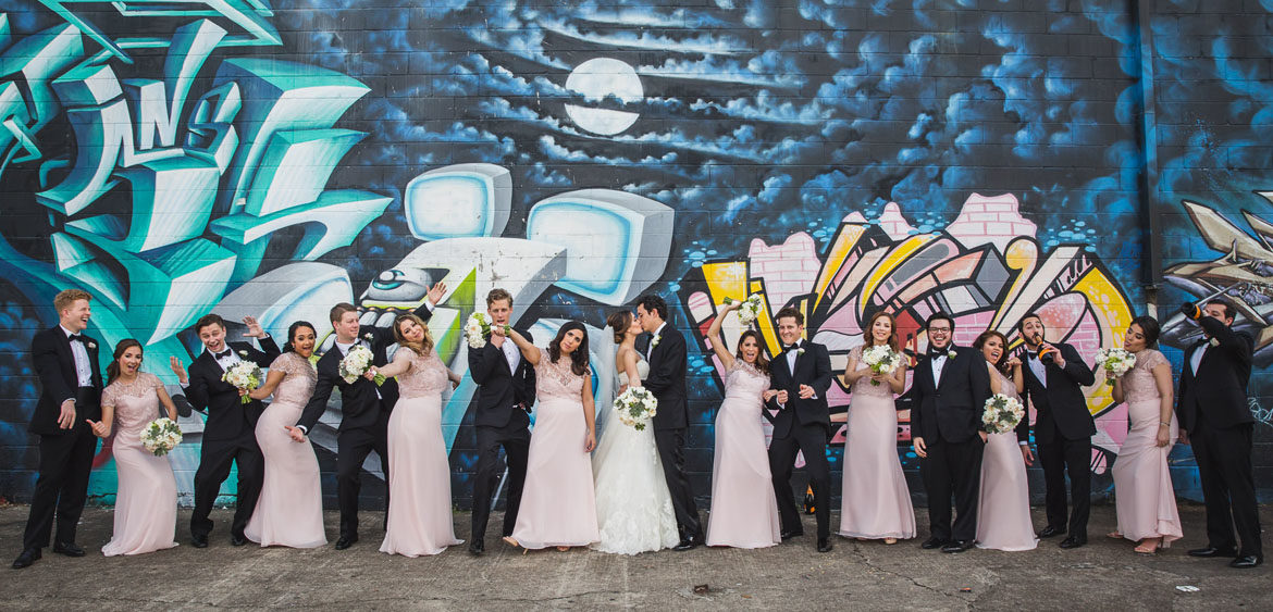 Nieto houston wedding party portrait at graffiti building wall by steve lee photography